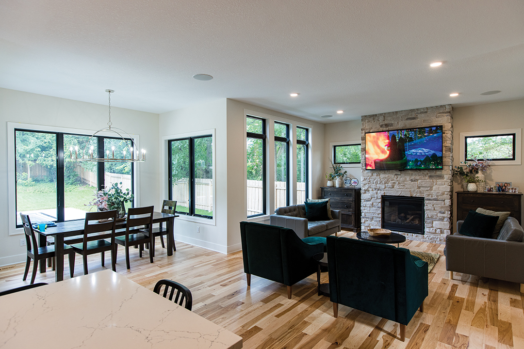 Kitchen features an oversized island and paneled appliances