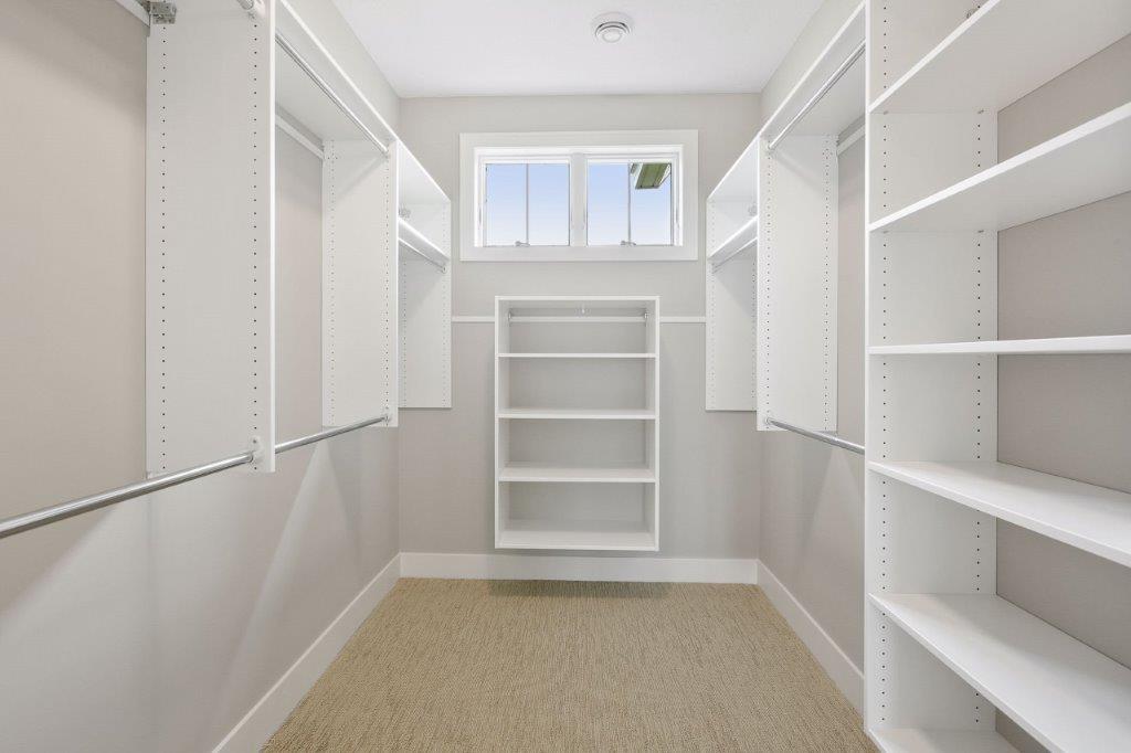 Owners’ ensuite walk-in closet with organizers